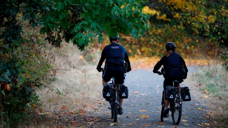 photo of two police officers on a bike